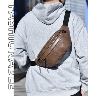 Person wearing a gray hoodie with a brown leather crossbody bag, with 'FASHIONABLE' text on the left.