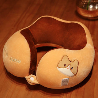 A plush neck pillow with a cute animal face design on the side, primarily in a brown color.